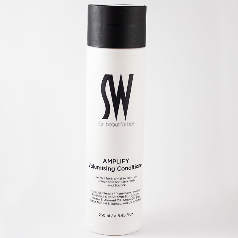 AMPLIFY Volumising Conditioner gives high gloss body and bounce.